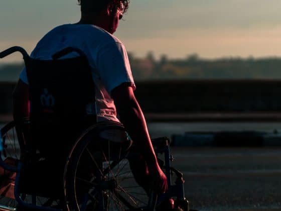 Man Riding On Wheelchair During Daytime