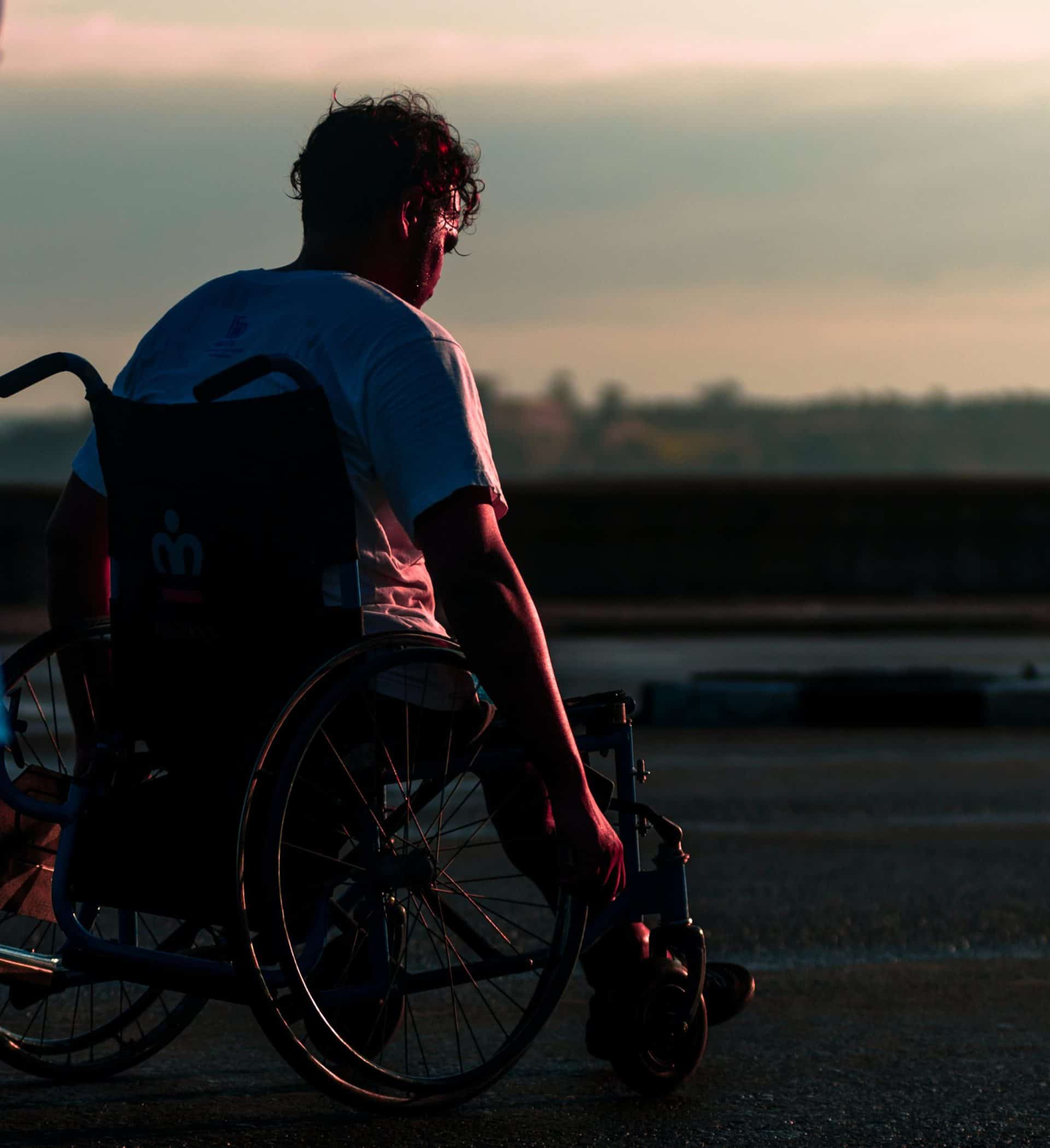 Man Riding On Wheelchair During Daytime